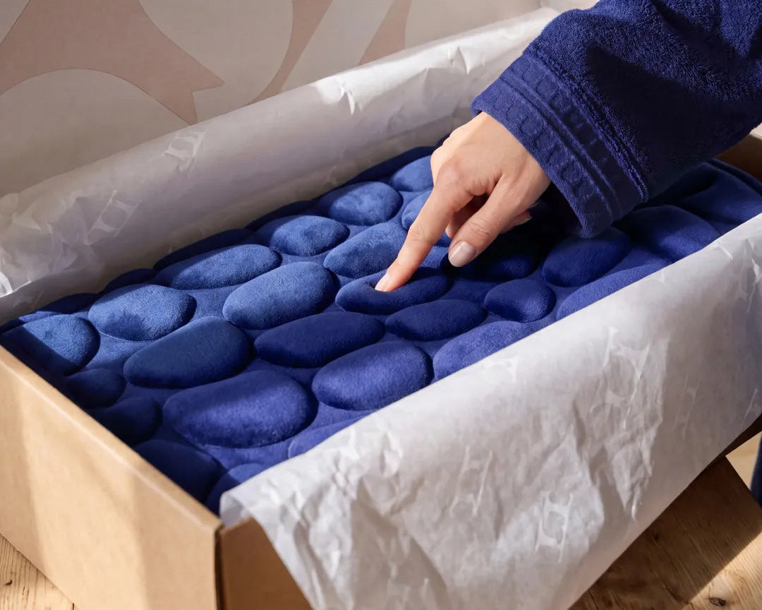 Tapis de bain galet dans son emballage